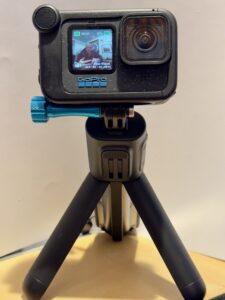 Photo of an GoPro 12 Black action camera.