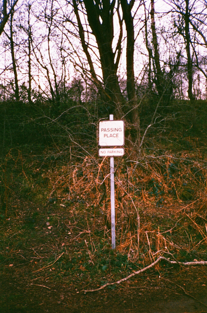 Road sign saying Passing Place, no parking