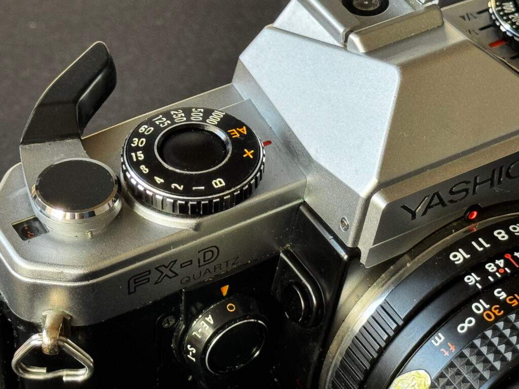 Yashica FX-D camera, showing shutter speed dial and rewind lever