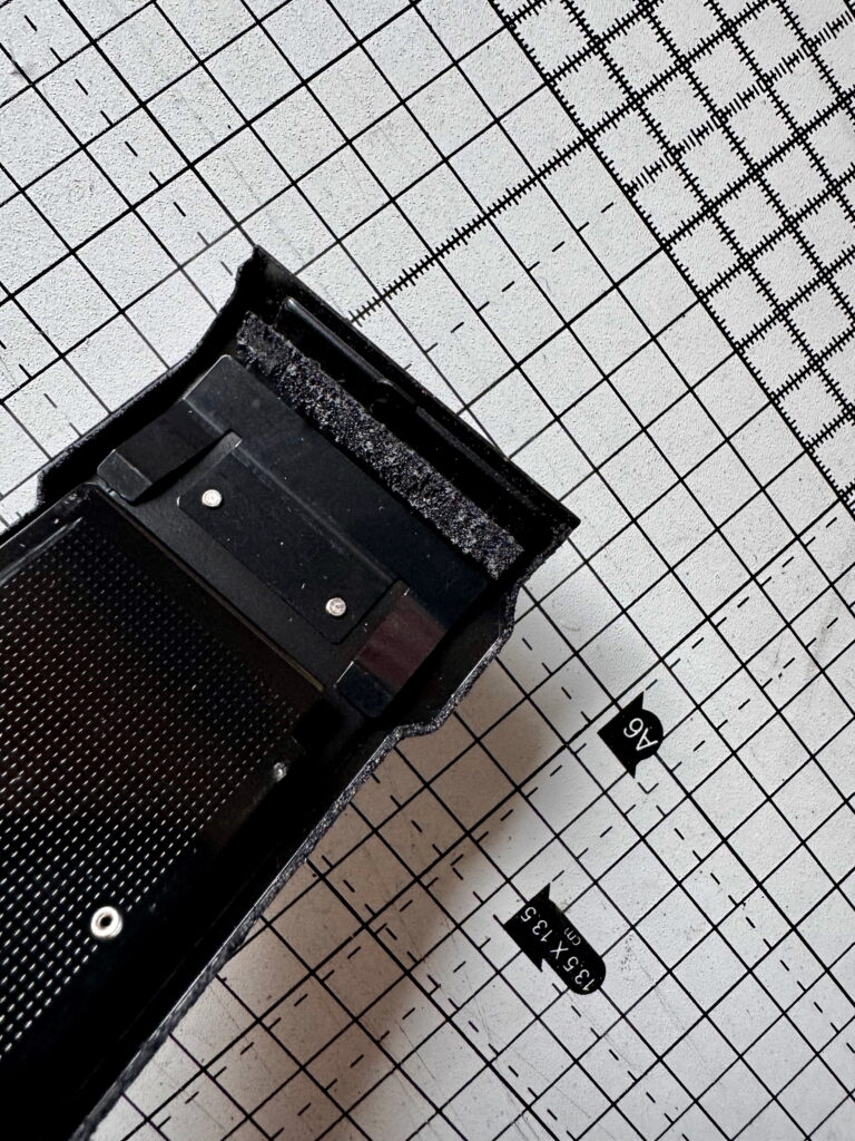 Yashica FX-D film door , with a really sticky light seal.