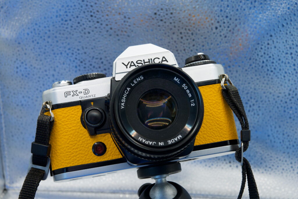Yashica FX-D Quartz, with sunshine yellow leather covering.
