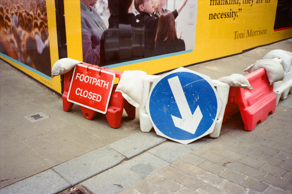 Footpath closed sign and a those way arrow sign.