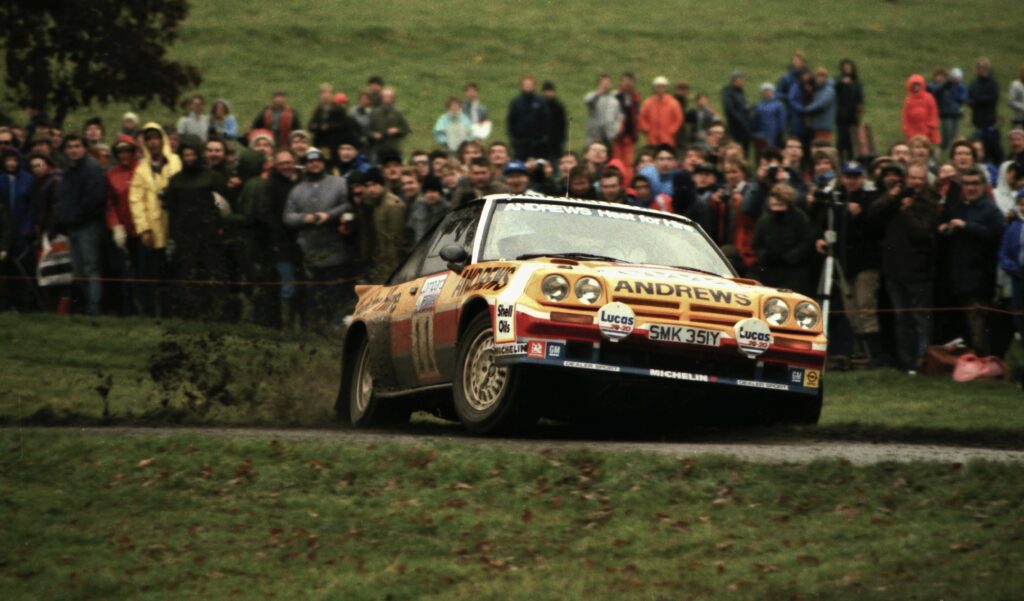 Opel Manta i400 loses the back end on a muddy road.