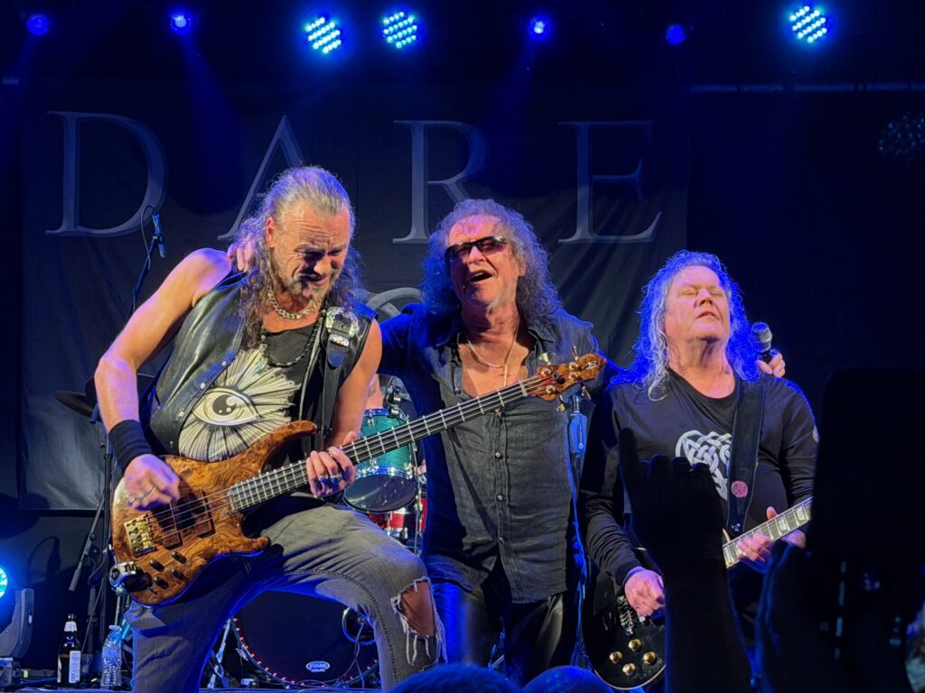 3 musicians centre stage