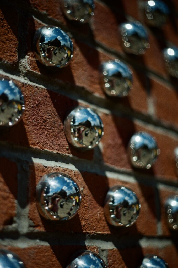 shiny half spheres on a wall